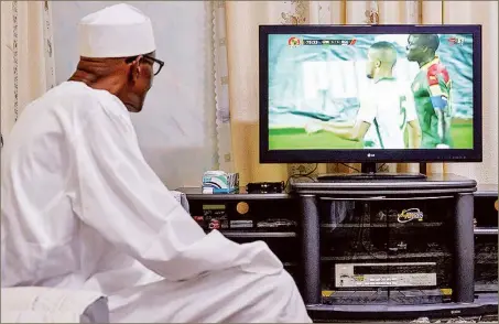  ??  ?? President Muhammadu Buhari watching the return leg of Nigeria-Cameroun World Cup qualifier match in Yaounde Cameroun at his home town in Daura, Katsina… yesterday