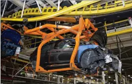  ?? LAURA MCDERMOTT — THE NEW YORK TIMES ?? A Chevrolet Bolt moves through the assembly line at the General Motors plant in Lake Orion, Mich. Some drivers of General Motors cars, like the Chevrolet Bolt, might not realize that their driving data is being shared with insurance companies.