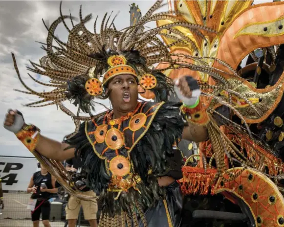  ?? MARCUS OLENIUK/TORONTO STAR ?? The sights and sounds of the Caribbean fill Toronto’s lakeshore as 16,000 joined the parade watched by tens of thousands Saturday at the annual pageant.