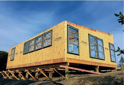  ??  ?? Pip Payne abandoned his dream of a personalis­ed home and went with an EasyBuild prefab design on Wellington’s Kapiti Coast, above.