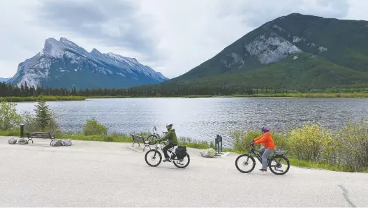  ?? PHOTOS: DEBBIE OLSEN ?? When cycling Alberta's Bow Valley Parkway to the Legacy Trail that connects Canmore and Banff, be sure to stop and enjoy the view at Vermillion Lakes.