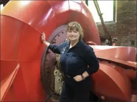  ?? MICHAEL HILL — ASSOCIATED PRESS ?? Natural Power Group co-owner Sarah Bower-Terbush stands in front of a power turbine at the company’s hydroelect­ric site in Wappingers Falls, N.Y., on June 5, 2019.