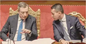  ?? ?? al senato.
Il premier Mario Draghi con al fianco il ministro degli Esteri Luigi Di Maio