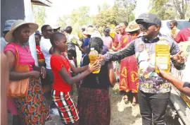  ?? ?? Dr Muswere donated cooking oil and soap to members of the community in Dowa, Makoni West.
— Pictures: Tinai Nyadzayo