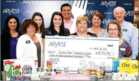  ?? Courtesy photo ?? The Samaritan Community Center has received funds from this year’s Arvest 1 Million Meals Campaign. The $12,992.90 financial donation will support SCC’s SnackPacks for Kids program during the 2017-18 academic year, and the 1,073 canned food items will...