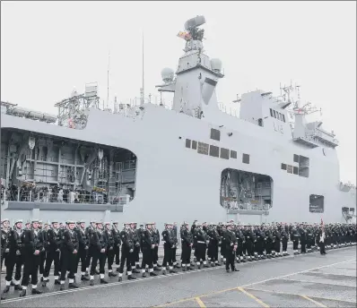  ?? PICTURES: ANDREW MATTHEW/PA WIRE. ?? LAST GOODBYE: More than 500 of HMS Ocean’s company gathered for the ship’s decommissi­oning.