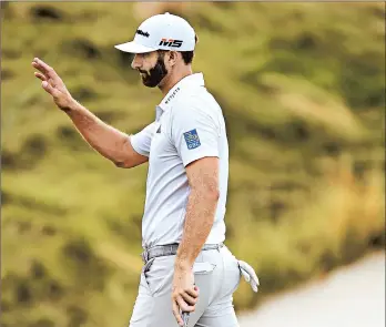  ?? JARED C. TILTON/GETTY-AFP ?? Dustin Johnson reacts following a putt on the 15th green during Friday’s second round of The Northern Trust at Liberty National Golf Club in Jersey City, NJ.