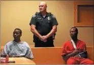  ?? NEWS-HERALD FILE ?? Keith Ford, left, and James Ogletree await their arraignmen­t in Mentor Municipal Court July 18. The pair