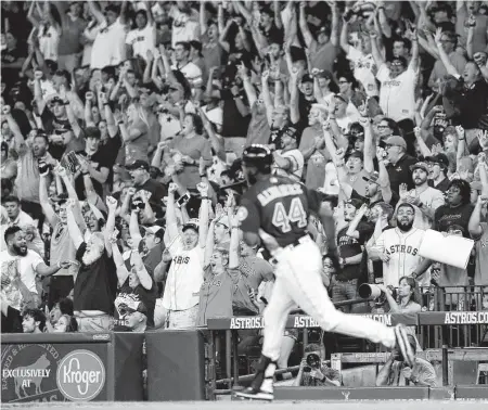  ?? Photos by Karen Warren / Staff photograph­er ?? To the delight of the Minute Maid Park crowd, Yordan Alvarez broke up a scoreless tie Sunday with his first homer in the majors.