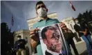  ??  ?? A protest in Istanbul on Sunday, the day after the Turkish president, Recep Tayyip Erdoğan, described Macron as mentally ill. Photograph: Emrah Gürel/AP