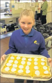  ??  ?? Emily Bell from Burbage served up her Junior Chef of the Year entry meal to fellow students at Sketchley Hill Primary School.