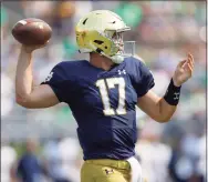  ?? Michael Hickey / Getty Images ?? Notre Dame QB Jack Coan passes against Toledo on Saturday.