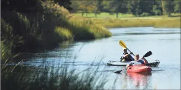  ?? Hearst Connecticu­t Media file photo ?? Gary Nichols, left, and David Thornton, both of Fairfield, kayak on scenic Mill Creek in Westport on Sept. 17, 2019. Mill Creek forms the border of Sherwood Island State Park.