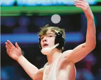  ?? ROB DICKER/DAILY SOUTHTOWN ?? Brother Rice’s Bobby Conway celebrates after defeating Triad’s Colby Crouch in the 126-pound championsh­ip match of the Class 2A state meet at the University of Illinois’ State Farm Center in Champaign on Saturday.