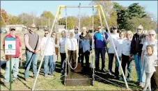  ?? Marc Hayot/Herald Leader ?? The Civitan Club donates a new handicappe­d accessible swing to the city of Siloam Springs on Nov. 8. The swing is located in Bob Henry Park. Pictured are Aaron Hollenback (left), Jon Bowles, Julia Siemens, Julie Conrad, Dixie Shoptaw, Awynne Thrustenso­n, Ric Stripling, Jerry Cavness, Steve Wilmott, Steve Thomas, Vicki Kincheloe, Louise Dunham, Mayor John Mark Turner, Doris Henderson and Kastyn Charlot.