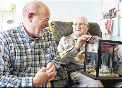  ?? ERIC Bourque/tri-county Vanguard ?? Rick Young, left, chats with Miff O’connell at Veterans Place in Yarmouth. Young was there to present O’connell with a model he had made of a Staghound armoured vehicle.