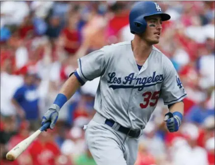  ?? JOHN MINCHILLO - THE ASSOCIATED PRESS ?? FILE - In this June 17, 2017, file photo, Los Angeles Dodgers’ Cody Bellinger watches his two-run home run off Cincinnati Reds starting pitcher Asher Wojciechow­ski during a baseball game in Cincinnati.