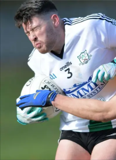  ??  ?? Declan Byrne, St. Mochta’s makes his presence felt with Longwood’s Christophe­r Lynch. Pictures: Ken Finegan