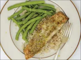  ?? MELISSA D’ARABIAN VIA AP ?? Mustard and dill crusted salmon