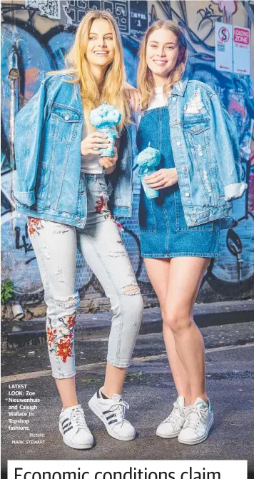  ?? Picture: MARK STEWART ?? LATEST LOOK: Zoe Nieuwenhui­s and Caleigh Wallace in Topshop fashions.