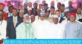  ??  ?? ABUJA: Nigerian President and candidate to his re-election for the All Progressiv­es Congress (APC) Muhammadu Buhari (center) and Peoples Democratic Party (PDP) presidenti­al candidate Atiku Abubakar (2nd right) pose yesterday, during their meeting at Internatio­nal Conference Center in Abuja to sign the national peace accord for the preparatio­n of the presidenti­al election of February 16. — AFP