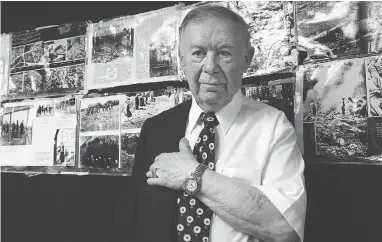  ?? SHIRLEY LIN / POSTMEDIA NEWS FILES ?? In this 2011 photo, Holocaust survivor Philip Riteman shows the prisoner number 98706 that was tattooed on his arm when he laboured at Nazi concentrat­ion camps. He was the only member of his family to survive the camps.