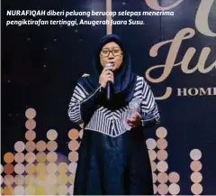  ??  ?? NURAFIQAH diberi peluang berucap selepas menerima pengiktira­fan tertinggi, Anugerah Juara Susu.