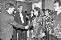  ??  ?? Shafie and Kwan shaking hands with guests attending the Institute of Architect Malaysia Sabah Chapter 43rd Annual Dinner at Shangri-La’s Tanjung Aru Resort on Saturday night.