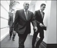  ?? AP/J. SCOTT APPLEWHITE ?? House Majority Whip Steve Scalise (front), R-La, returns to his office Tuesday on Capitol Hill after House Republican­s heard a two-step plan he helped negotiate to try to curb President Barack Obama’s executive orders on immigratio­n but still provide...