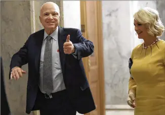  ?? AP ?? Sen. John McCain, shown returning to the Senate on Tuesday with his wife, Cindy, urged his colleagues in a speech to “trust each other. Let’s return to regular order. We’ve been spinning our wheels on too many important issues because we keep trying to find a way to win without help from across the aisle.”