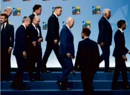  ?? DOUG MILLS/NEW YORK TIMES ?? President Biden walked off stage with allied heads of state and government at the NATO summit in Lithuania Tuesday.