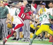  ?? CURTIS COMPTON / CCOMPTON@AJC.COM ?? The Falcons’ Julio Jones makes a first-down catch vs. the Packers on Sunday night, when he posted five receptions for 108 yards.