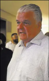  ?? ELIZABETH BRUMLEY/LAS VEGAS REVIEW-JOURNAL ?? Clark County Commission­er Steve Sisolak speaks with a guest inside a suite Tuesday at Aria. Sisolak is considered the frontrunne­r if he decides to run for Nevada governor in 2018, but the state hasn’t elected a Democrat to the job since 1994.