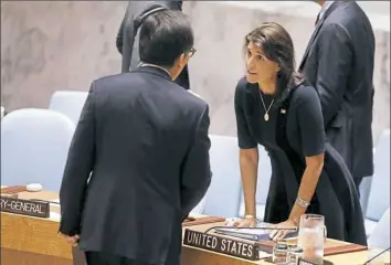  ?? Richard Drew/Associated Press ?? U.S. Ambassador Nikki Haley, right, talks with South Korean Ambassador Cho Tae-yong at a meeting of the United Nations Security Council at U.N. Headquarte­rs on Monday.