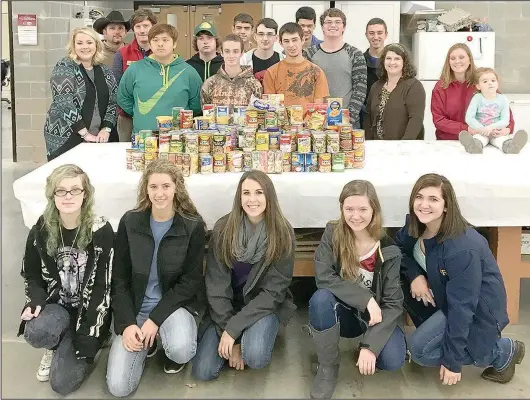  ?? SUBMITTED PHOTO ?? The Washington County Farm Bureau Young Farmers and Ranchers donated the cans from their canned food drive so that the Lincoln FFA Chapter could compete in Food For America.