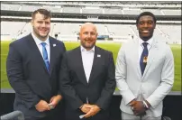  ?? Contribute­d photo ?? Central Connecticu­t defensive lineman Chris Tinkham, coach Pete Rossomando and wide receiver Courtney Rush pose for a photo during NEC media day at MetLife Stadium in East Rutherford, N.J. on Tuesday.
