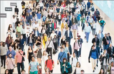  ?? (AP) ?? In this file photo, commuters walk through a corridor in the World Trade Center Transporta­tion Hub in New York. Millennial workers are more likely than older generation­s to report being burned out at work, according to a 2018 Gallup study. The gig economy, the temptation­s of social media and the high
expectatio­ns millennial­s have of themselves contribute to this trend, behavioral finance experts say.