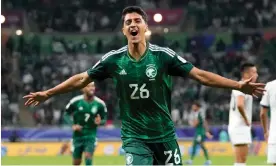  ?? Photograph: Aijaz Rahi/AP ?? Faisal Al-Ghamdi celebrates after scoring Saudi Arabia’s second goal late in the game.