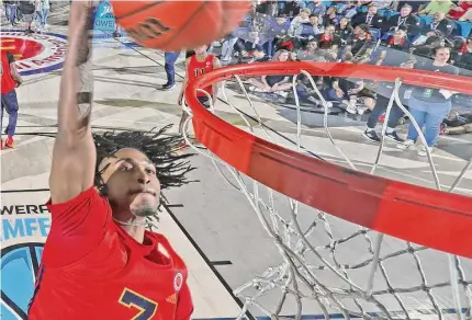  ?? Brian Spurlock/Icon Sportswire via Getty Images ?? UConn recruit Stephon Castle dunks in the 2023 Powerade Jamfest at Delmar Fieldhouse on March 27 in Houston.