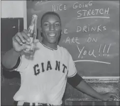  ?? LEO COHEN — STAFF ARCHIVES ?? The Giants’ Willie McCovey, whose nickname was “Stretch”, offers soda pop in the locker room during his NL Rookie of the Year season of 1959.