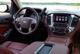  ??  ?? The Suburban’s front cabin is dominated by a large digital touchscree­n display in the center of the dash. This all-new design makes the 2015 Suburban look and feel more like a luxury SUV than its past incarnatio­ns.