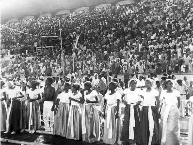  ??  ?? Part of the large crowd which attended the Centenary Anniversar­y celebratio­ns marking Kingston as the capital of Jamaica, which was held at the National Stadium, is seen standing at the playing of the National Anthem. Some of the performers are seen in the foreground.