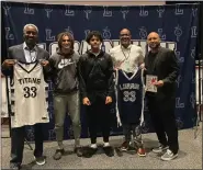  ?? ALIAH KIMBRO — THE MORNING JOURNAL ?? As a token of appreciati­on, Kielian presented guest speakers Stephen Bardo and Darrell Wilson with their very own Lorain High basketball jerseys.