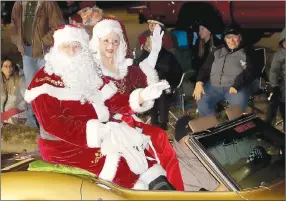  ?? File photo ?? Santa and Mrs. Claus wave to spectators along the route during the 2023 Farmington Christmas Parade on Dec. 2.