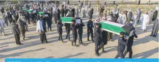  ?? ?? KUWAIT: The remains of Kuwait’s martyrs are laid to rest during a military procession. —KUNA photos