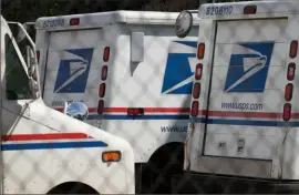  ?? Scott Olson/Getty Images ?? United States Postal Service trucks are parked at a postal facility in Chicago.