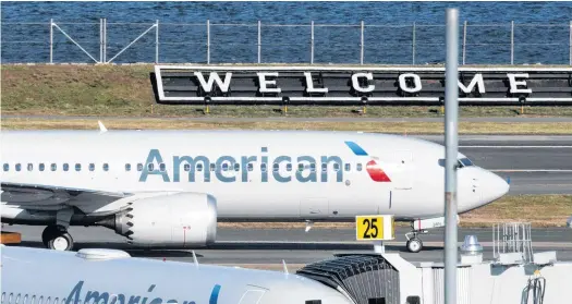  ?? EDUARDO MUNOZ • REUTERS ?? American Airlines flight 718, the first U.S. Boeing 737 MAX commercial flight since regulators lifted a 20-month grounding in November, lands at Laguardia airport in New York.