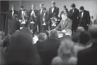  ?? NWA DEMOCRAT-GAZETTE/J.T. WAMPLER ?? Rogers Mayor Greg Hines leads a prayer during the 2016 Rogers Mayor’s Prayer Breakfast for National Day of Prayer at Cross Church in Rogers. The first call to prayer was made in 1775, when the Continenta­l Congress asked the colonies to pray for wisdom...