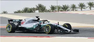  ?? GIUSEPPE CACACE/AFP/GETTY IMAGES ?? Mercedes driver Lewis Hamilton completes a practice circuit on Friday ahead of qualifiers for the Bahrain Formula One Grand Prix at the Sakhir circuit in Manama.