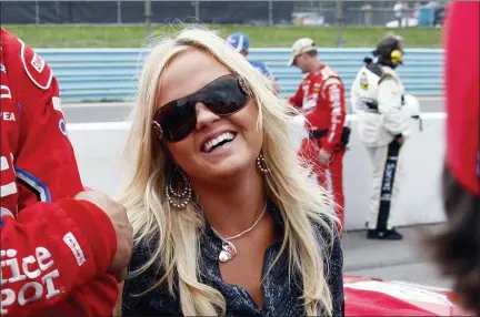  ?? DAVID DUPREY — THE ASSOCIATED PRESS FILE ?? In this Aug. 9, 2009, file photo, American Sprint Car Series driver Jessica Zemken, now Jessica Friesen, smiles a rain delay at the NASCAR Sprint Cup Series’ Heluva Good! Sour Cream Dips at The Glen auto race in Watkins Glen, N.Y.